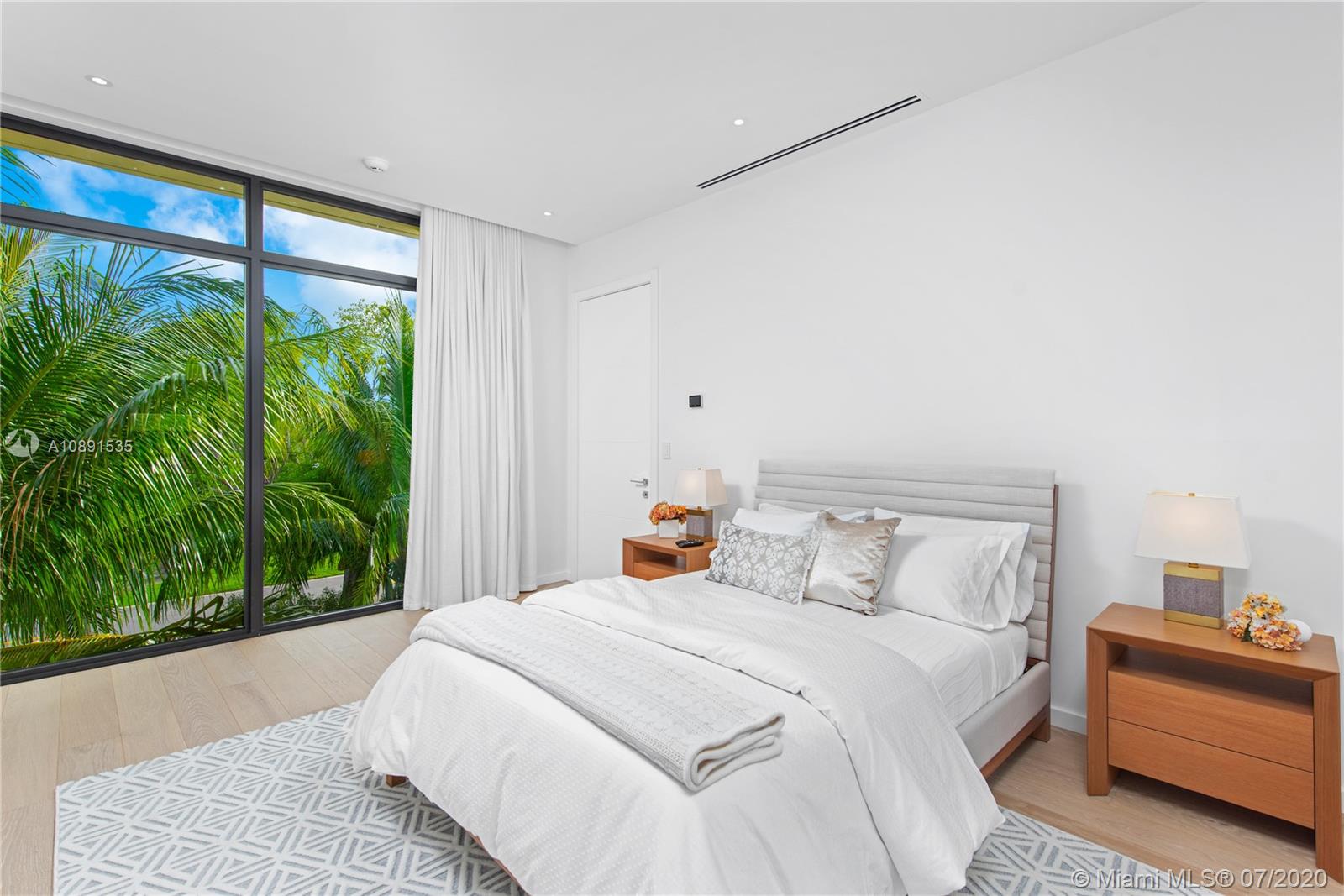 Sunset Islands Miami Beach, FL 33140 - Photo 26 of 72 a bedroom with a bed and a large window