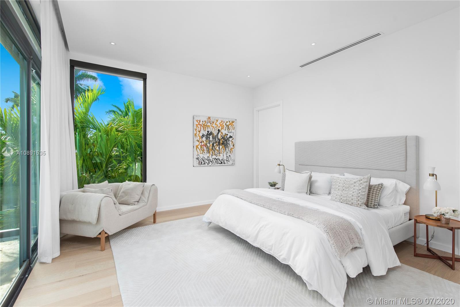 Sunset Islands Miami Beach, FL 33140 - Photo 28 of 72 a bedroom with a bed and a couch