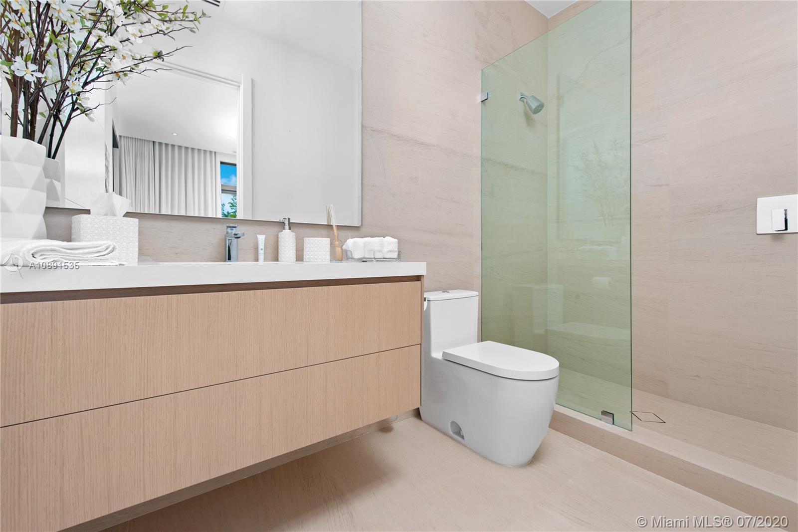 Sunset Islands Miami Beach, FL 33140 - Photo 29 of 72 a bathroom with a sink toilet and a mirror