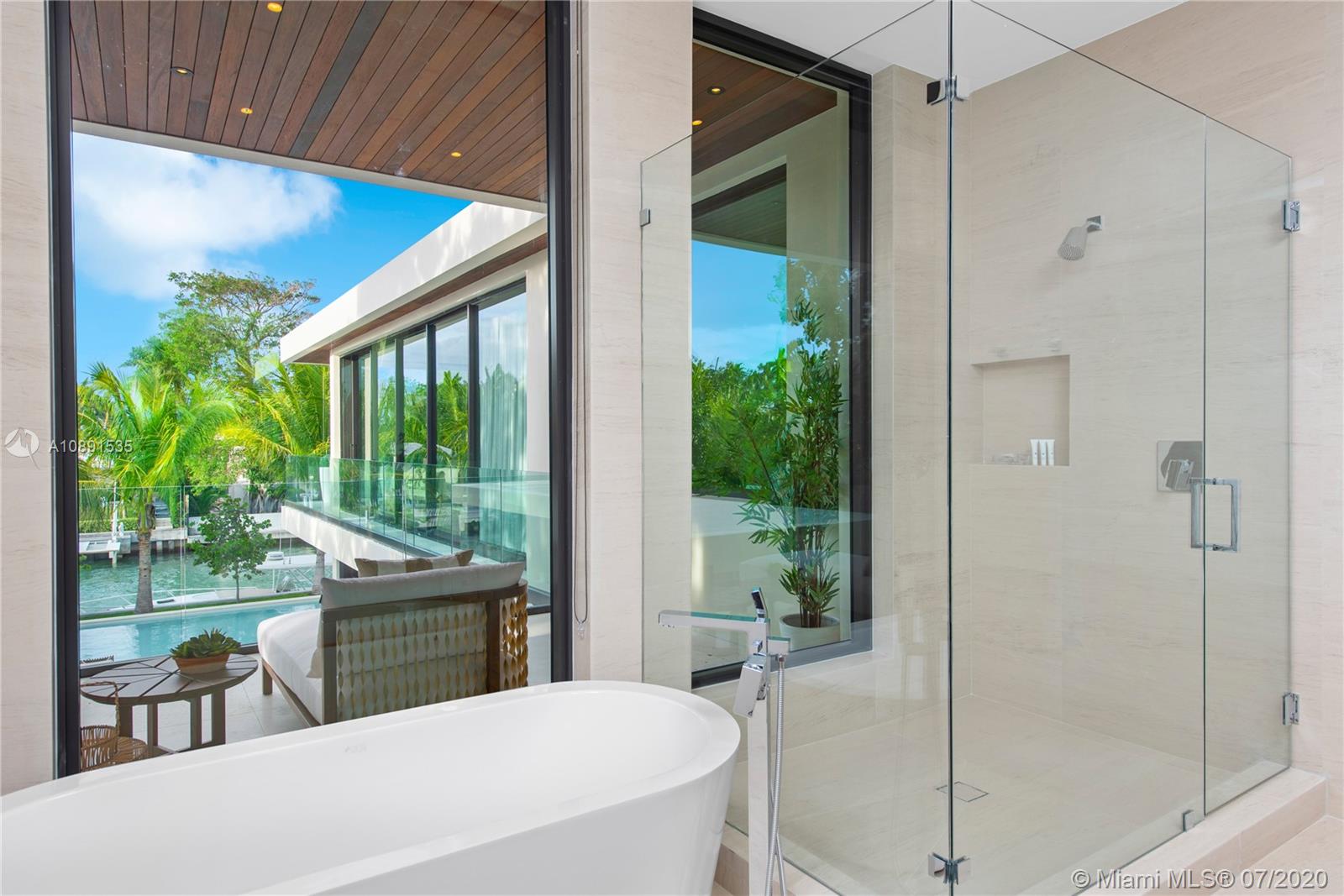 Sunset Islands Miami Beach, FL 33140 - Photo 33 of 72 a room that has a bed and a table in it