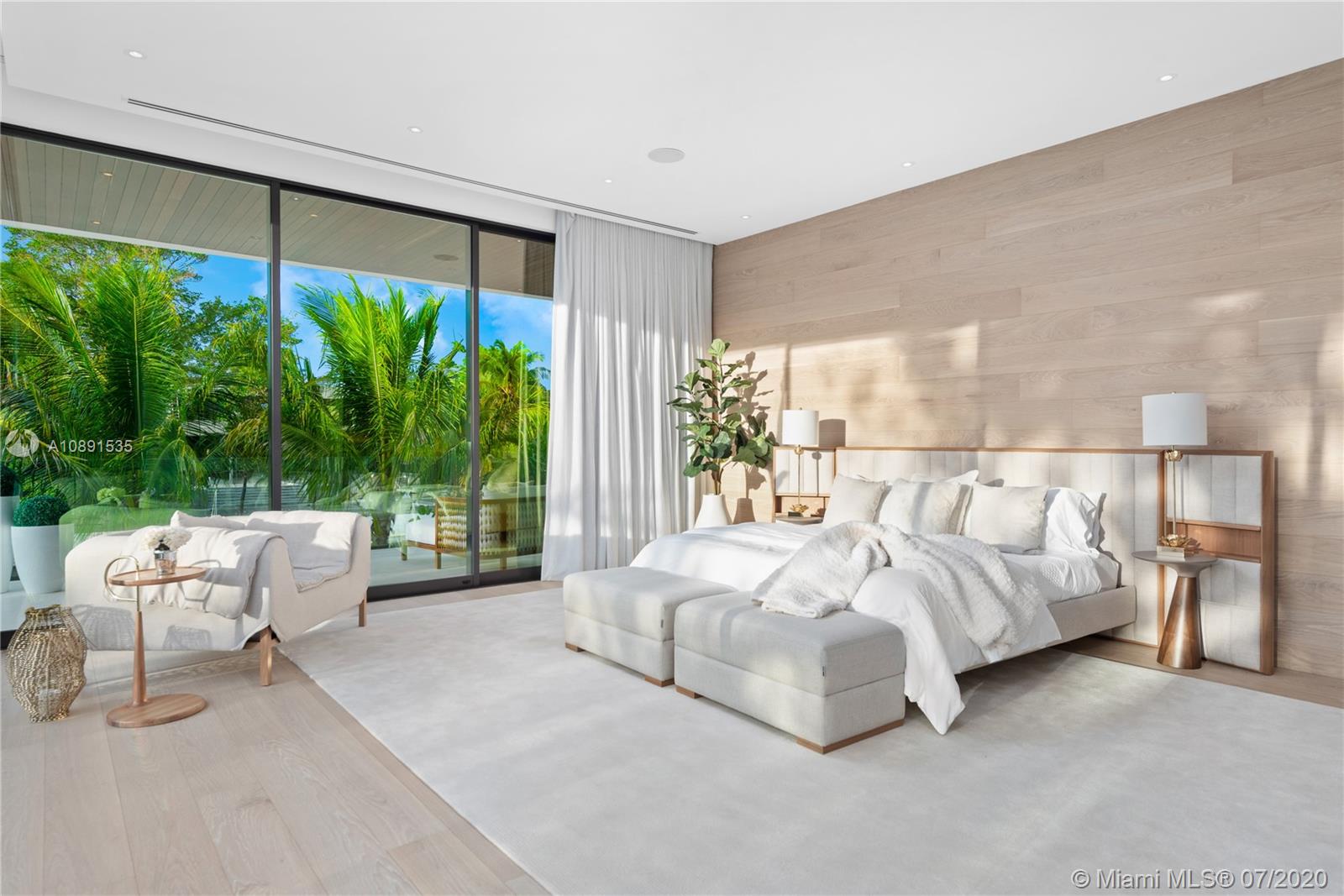 Sunset Islands Miami Beach, FL 33140 - Photo 37 of 72 a bed room with a bed and a large window