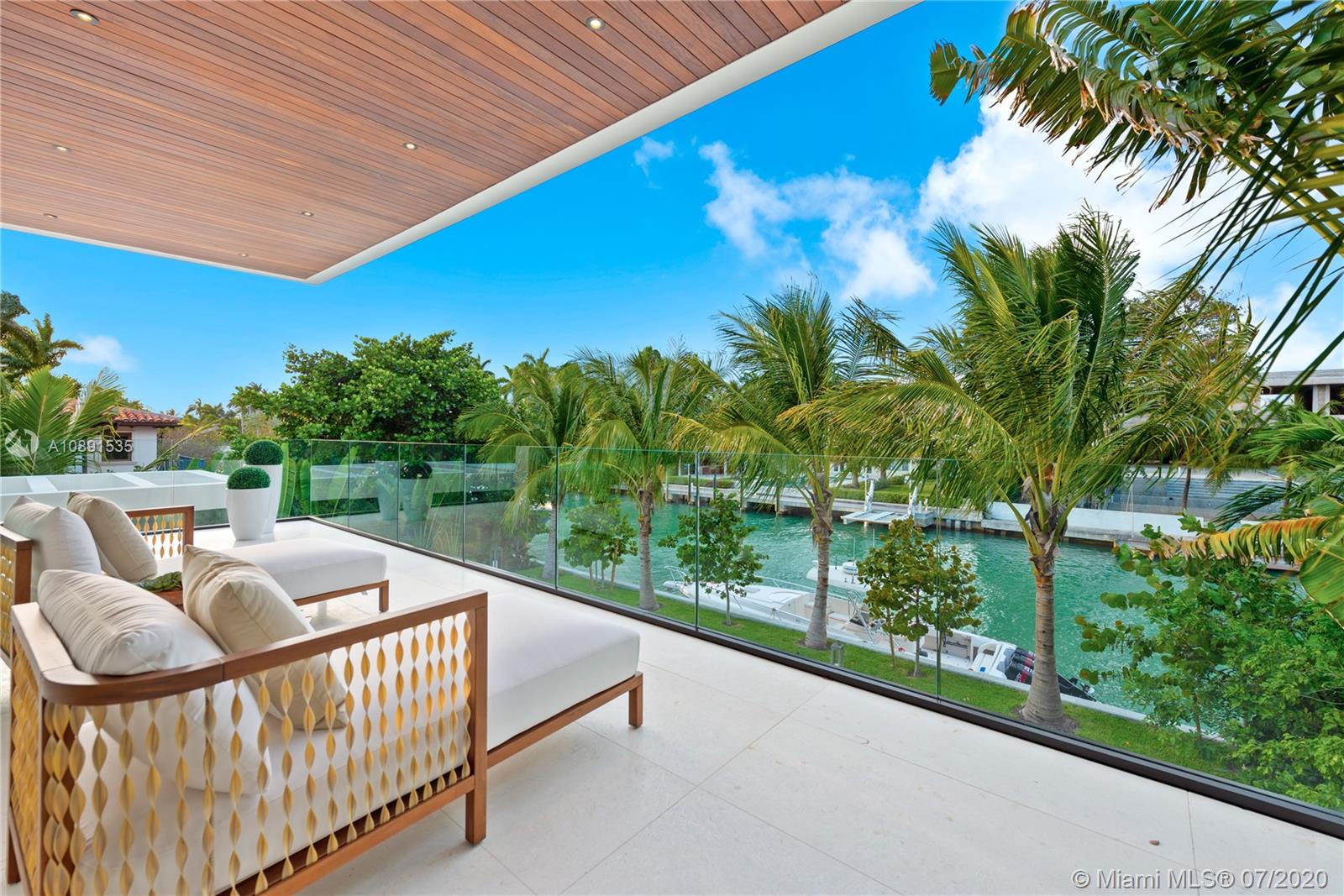 Sunset Islands Miami Beach, FL 33140 - Photo 38 of 72 a view of a roof deck with couches and wooden fence