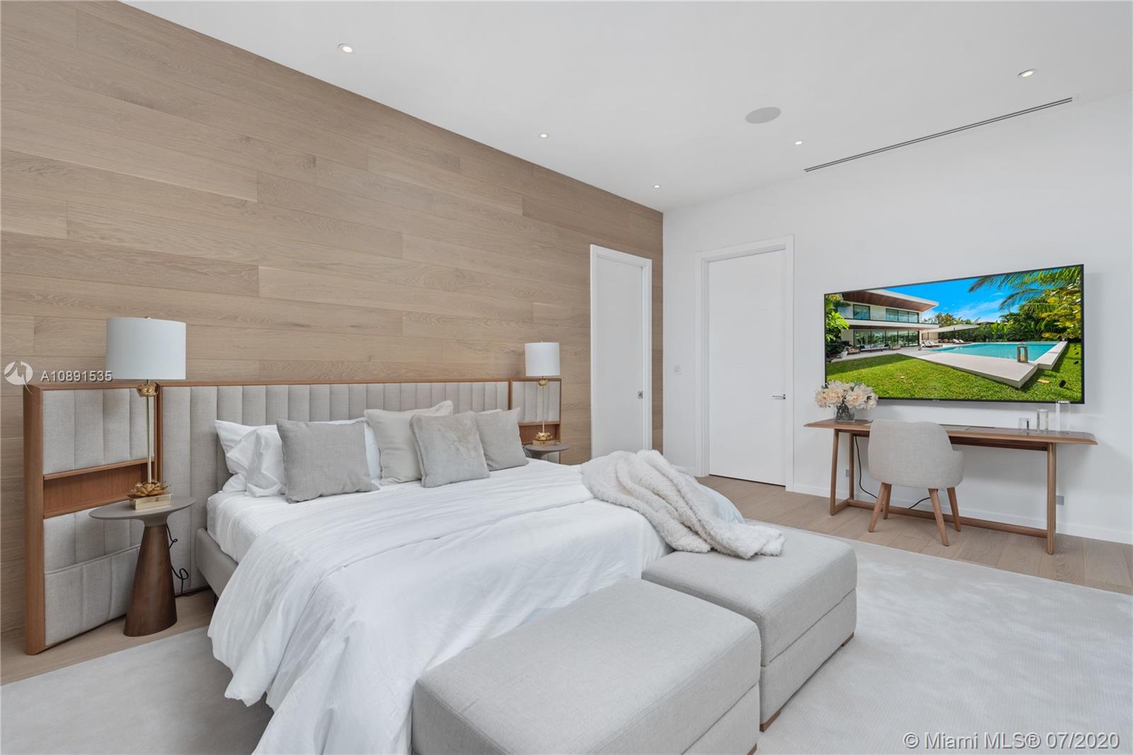 Sunset Islands Miami Beach, FL 33140 - Photo 42 of 72 a bedroom with a bed and a flat screen tv