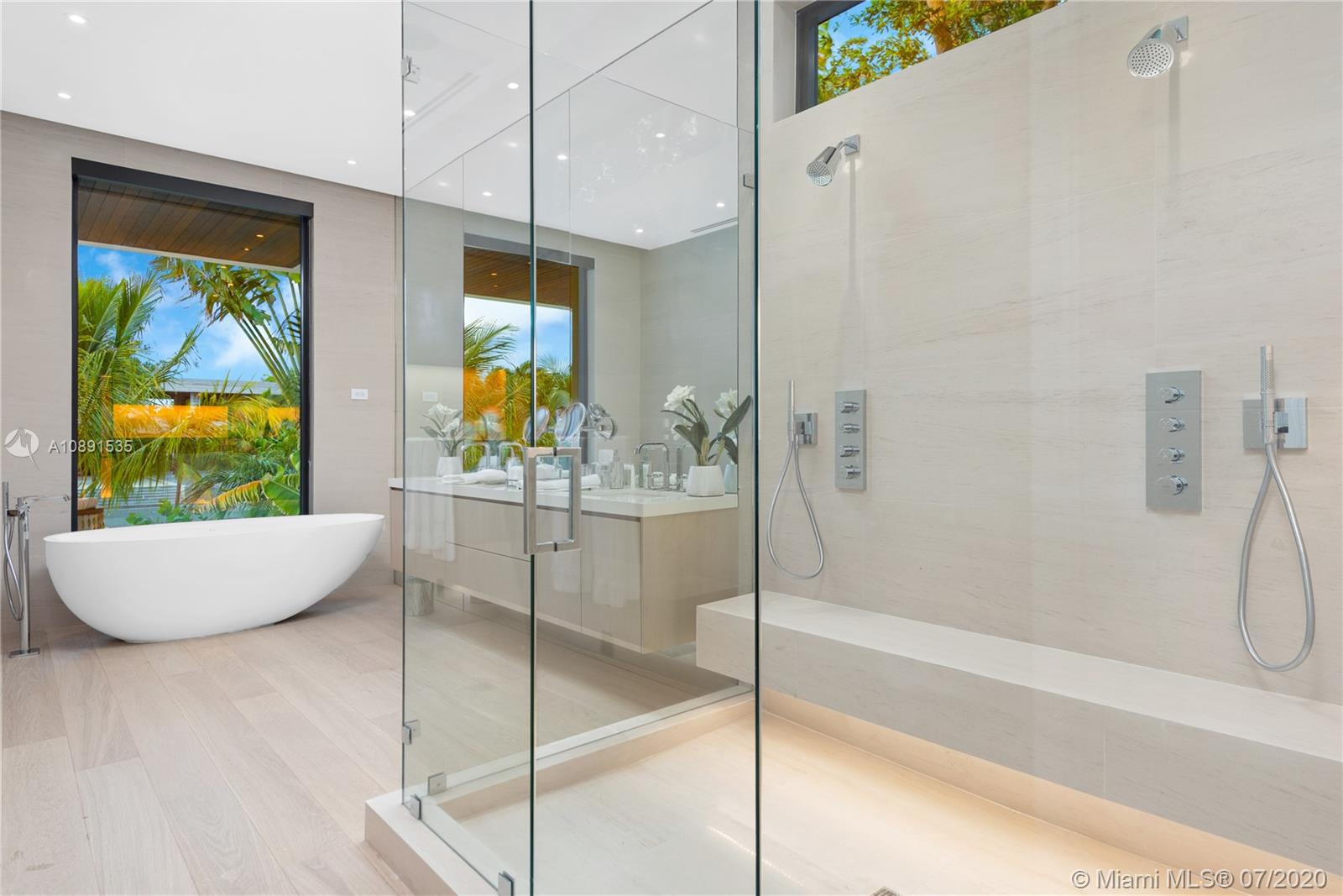 Sunset Islands Miami Beach, FL 33140 - Photo 45 of 72 a living room with a large window and table