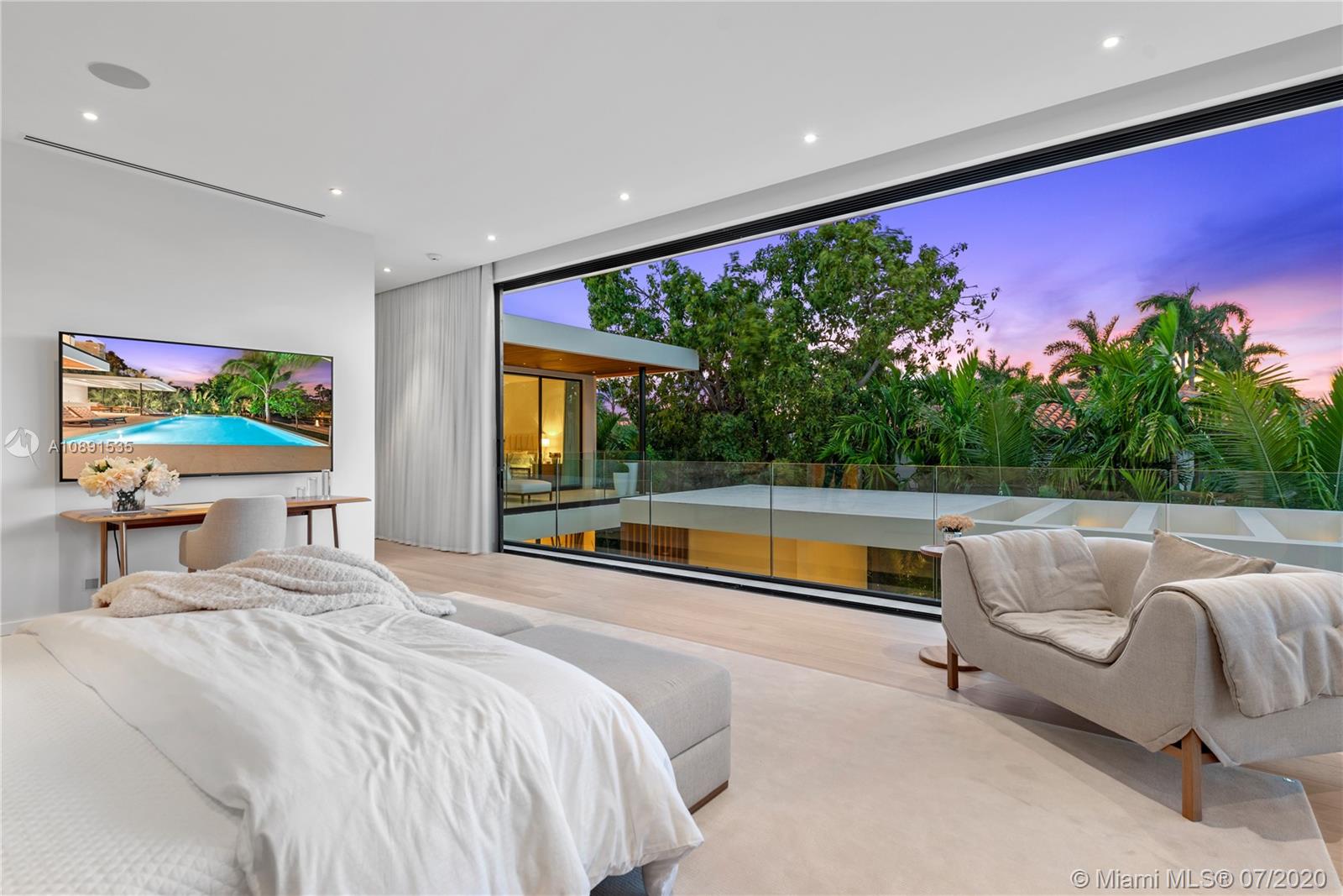 Sunset Islands Miami Beach, FL 33140 - Photo 50 of 72 a bedroom with furniture and a large window