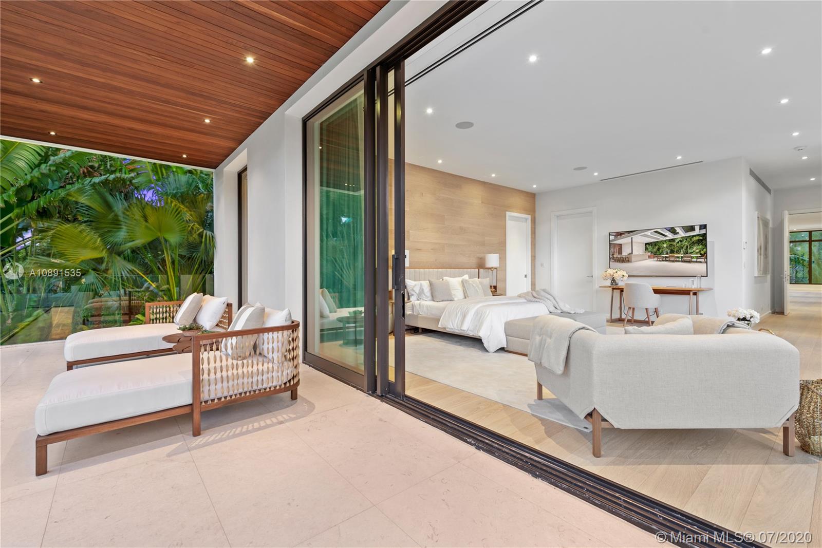 Sunset Islands Miami Beach, FL 33140 - Photo 51 of 72 a living room with furniture and a large window