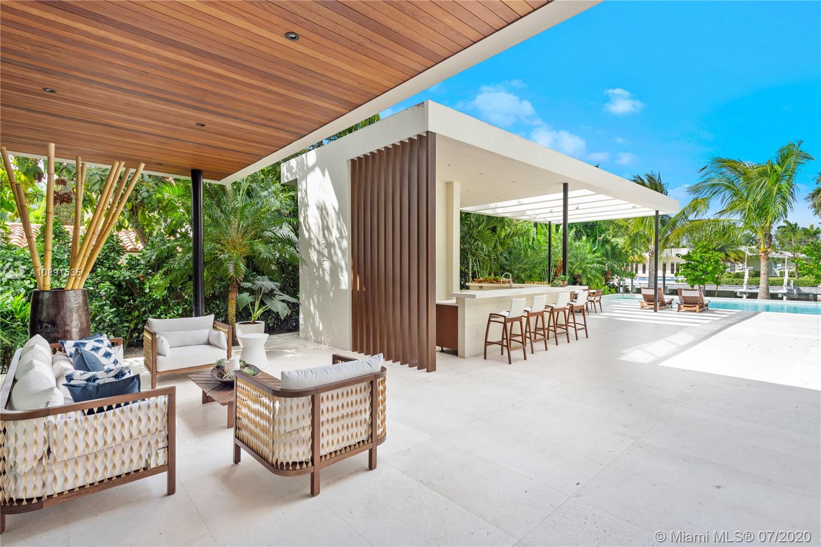 Sunset Islands Miami Beach, FL 33140 - Photo 6 of 72 a view of a patio with a table and chairs and potted plants