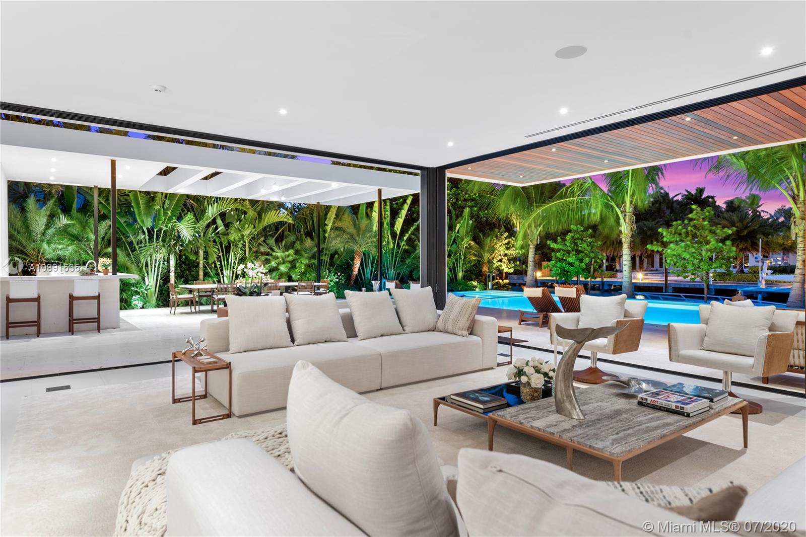 Sunset Islands Miami Beach, FL 33140 - Photo 62 of 72 a living room with patio furniture and a large window