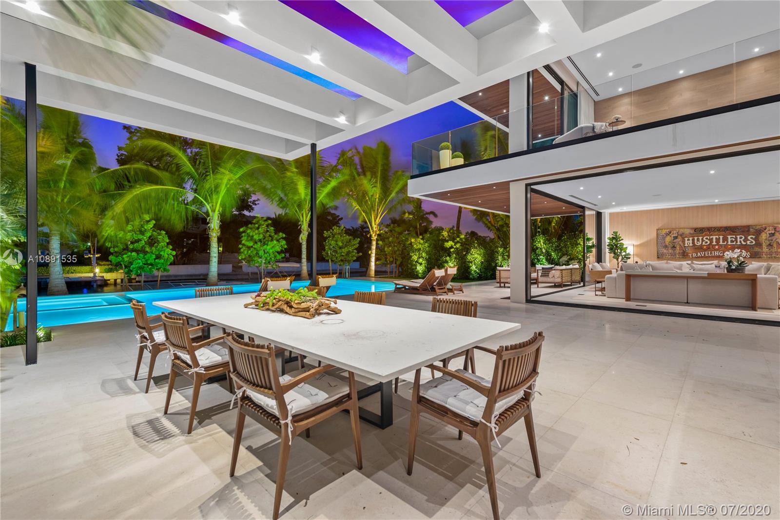Sunset Islands Miami Beach, FL 33140 - Photo 65 of 72 a view of a patio with a table and chairs under an umbrella