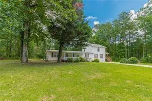 a house with a tree in front of it