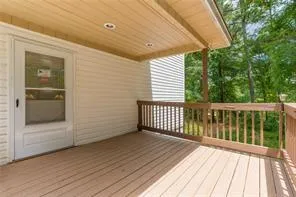 a view of a balcony with wooden floor