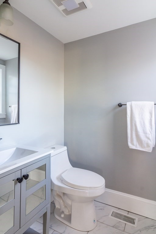 17 Andrews Street Danvers, MA 01923 - Photo 13 of 42 a white toilet sitting next to a bathroom sink