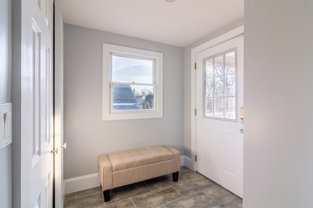 17 Andrews Street Danvers, MA 01923 - Photo 14 of 42 a room with a couch and a window