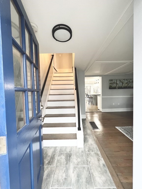 17 Andrews Street Danvers, MA 01923 - Photo 2 of 42 a view of staircase with white walls and a window