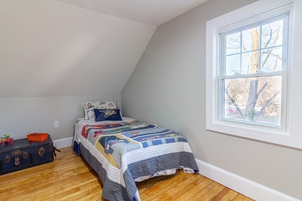 17 Andrews Street Danvers, MA 01923 - Photo 21 of 42 a bedroom with a bed and wooden floor