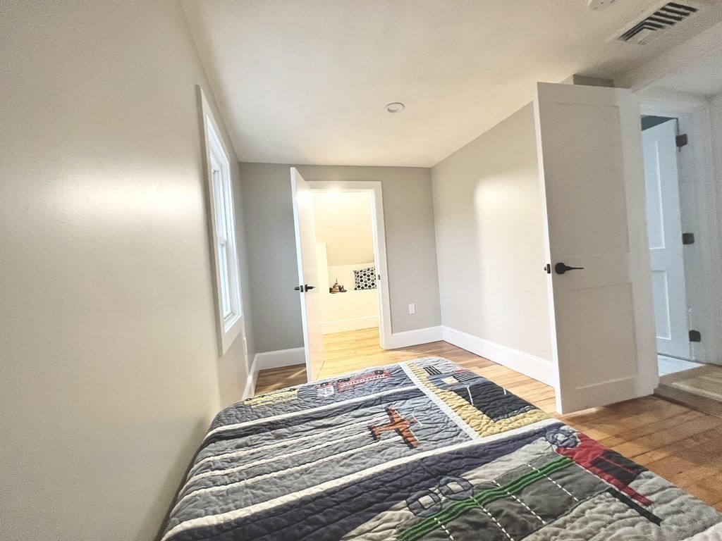 17 Andrews Street Danvers, MA 01923 - Photo 22 of 42 a bedroom with a bed and the view of bathroom