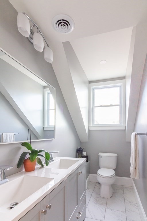 17 Andrews Street Danvers, MA 01923 - Photo 25 of 42 a bathroom with a toilet sink and mirror