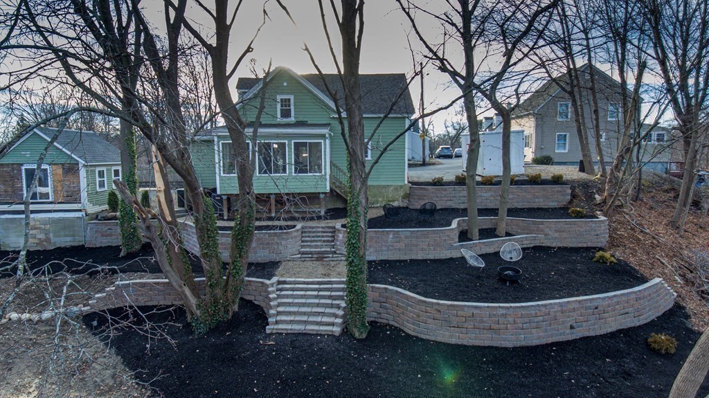 17 Andrews Street Danvers, MA 01923 - Photo 30 of 42 a backyard of a house with table and chairs