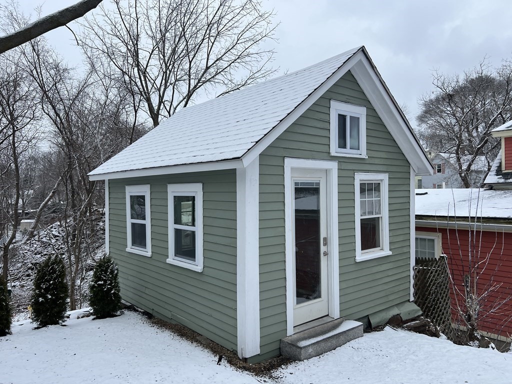 17 Andrews Street Danvers, MA 01923 - Photo 32 of 42 a front view of a house with a yard