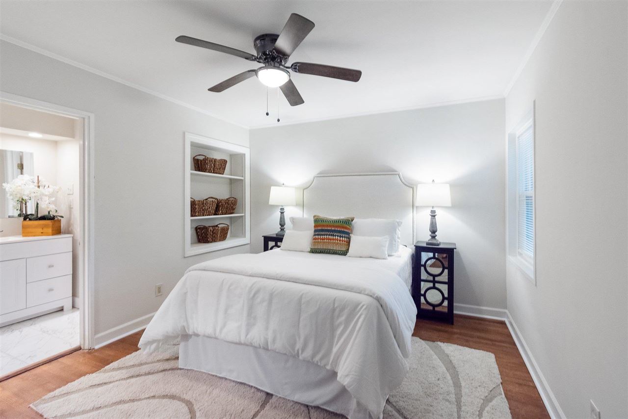 371 Wallace Road Memphis, TN 38117 - Photo 11 of 21 a bedroom with a bed and a chandelier