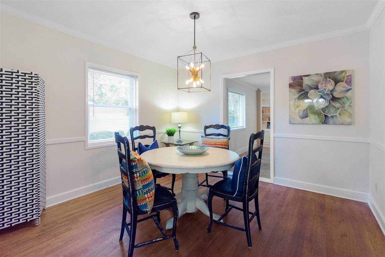 371 Wallace Road Memphis, TN 38117 - Photo 17 of 21 a view of a dining room with furniture window and wooden floor