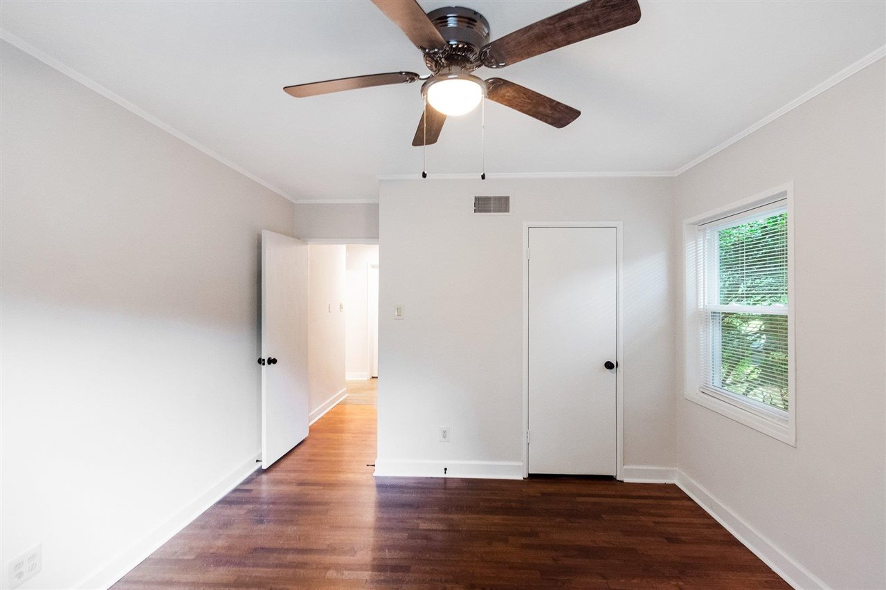 371 Wallace Road Memphis, TN 38117 - Photo 9 of 21 wooden floor in an empty room with a window