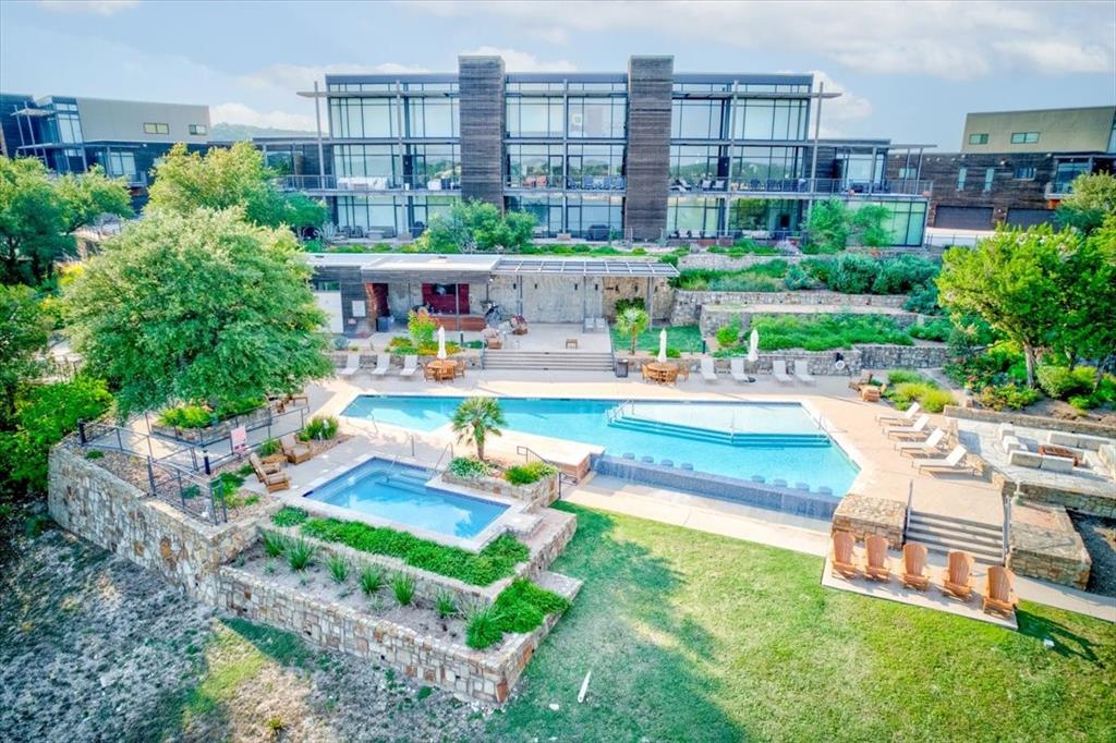 1101 Ivean Pearson Road, Unit A102 Lago Vista, TX 78645 - Photo 22 of 31 Community pool featuring a patio and a hot tub
