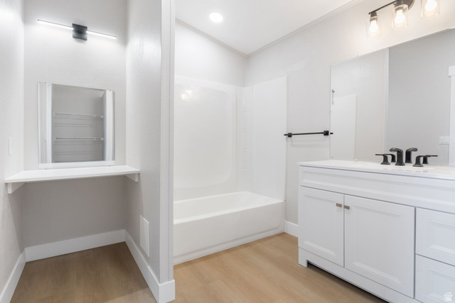 332 Hillgate Way Layton, UT 84041 - Photo 12 of 26 Bathroom featuring vanity, light wood-style floors, and tub / shower combination