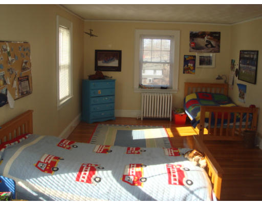 149 Common Street Watertown, MA 02472 - Photo 13 of 19 a living room with furniture and a flat screen tv