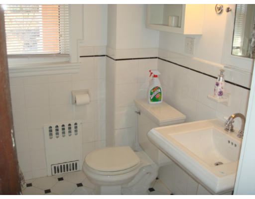 149 Common Street Watertown, MA 02472 - Photo 16 of 19 a bathroom with a sink a toilet and shower