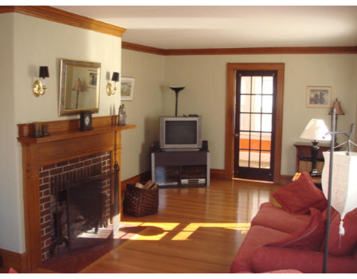 149 Common Street Watertown, MA 02472 - Photo 6 of 19 a living room with furniture a window and a fireplace