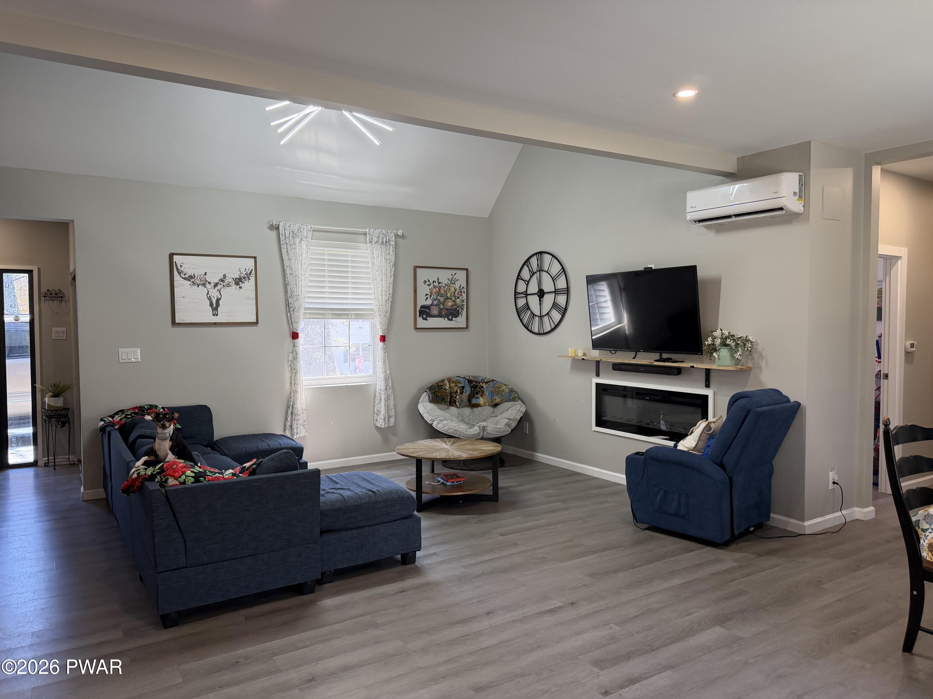 801 Maple Ridge Court Hawley, PA 18428 - Photo 13 of 55 a living room with furniture and a flat screen tv