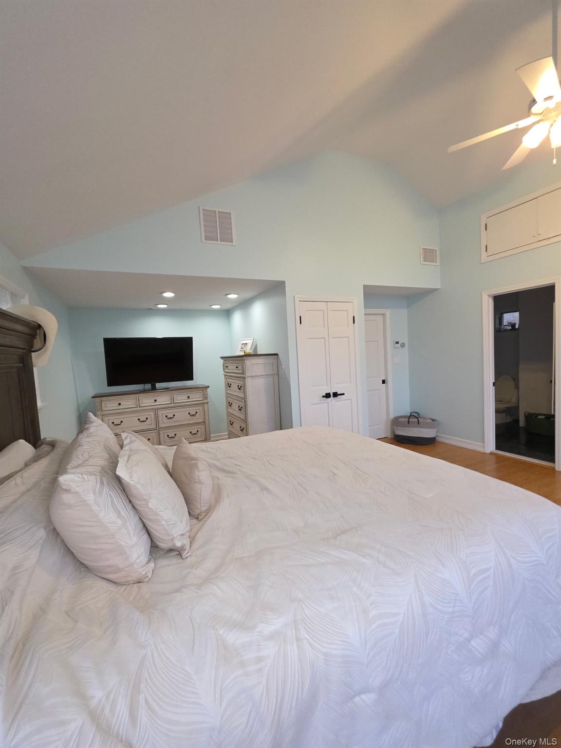 12-14 West 5th Road Queens, NY 11693 - Photo 22 of 43 Bedroom featuring a ceiling fan, high vaulted ceiling, and wood finished floors