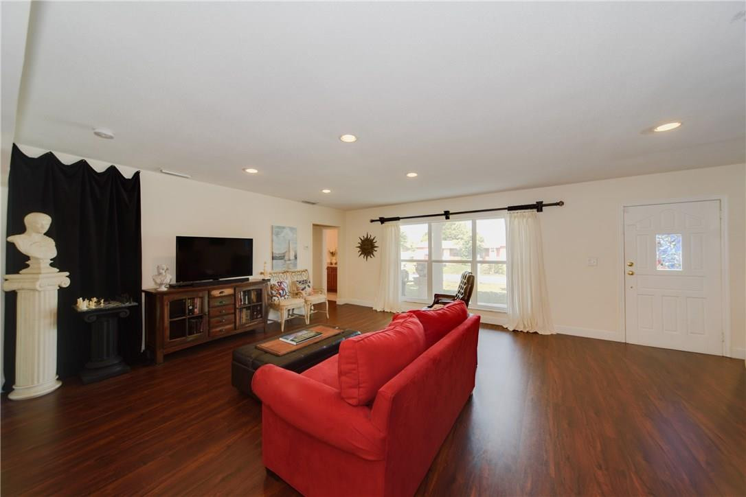 2660 Northeast 2nd Avenue Boca Raton, FL 33431 - Photo 6 of 29 a living room with furniture a flat screen tv and wooden floor