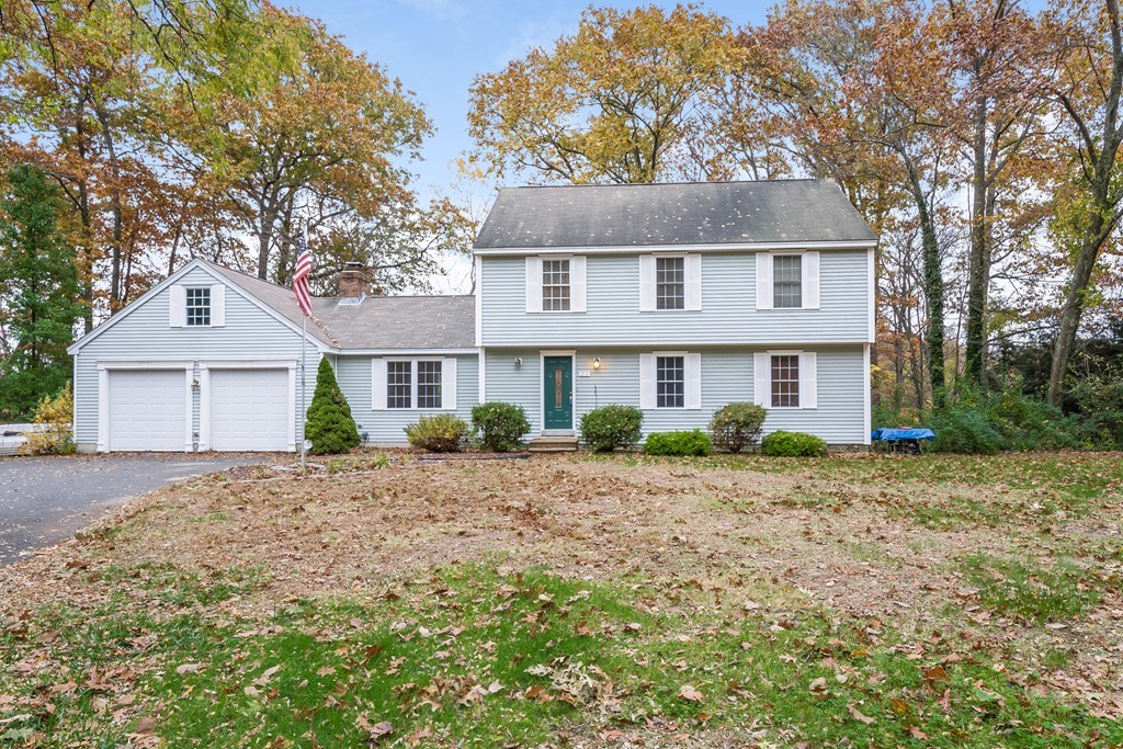 215 Bolton Road Lancaster, MA 01523 - Photo 1 of 14 a front view of a house with a yard