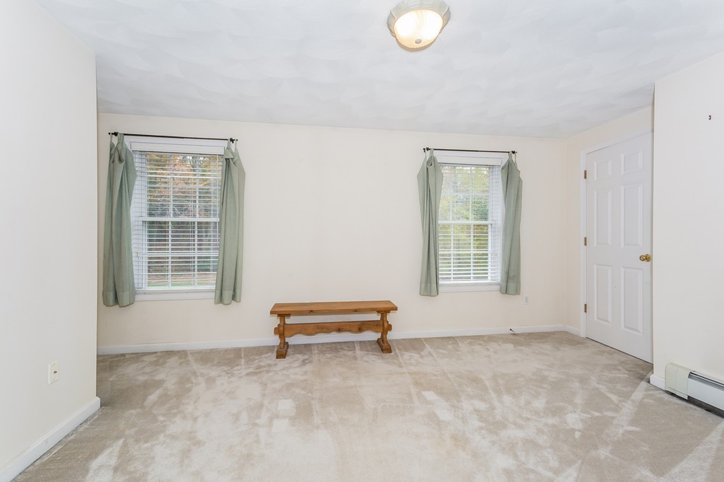 215 Bolton Road Lancaster, MA 01523 - Photo 11 of 14 a view of room with air conditioner and window