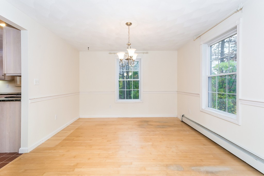215 Bolton Road Lancaster, MA 01523 - Photo 5 of 14 a view of a room with a large window