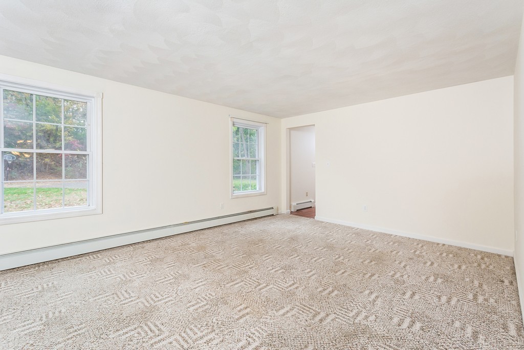 215 Bolton Road Lancaster, MA 01523 - Photo 6 of 14 an empty room with windows