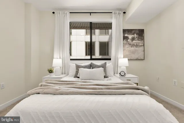 a bedroom with a bed and a closet