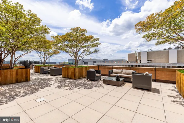 a view of a storage house with wooden fence