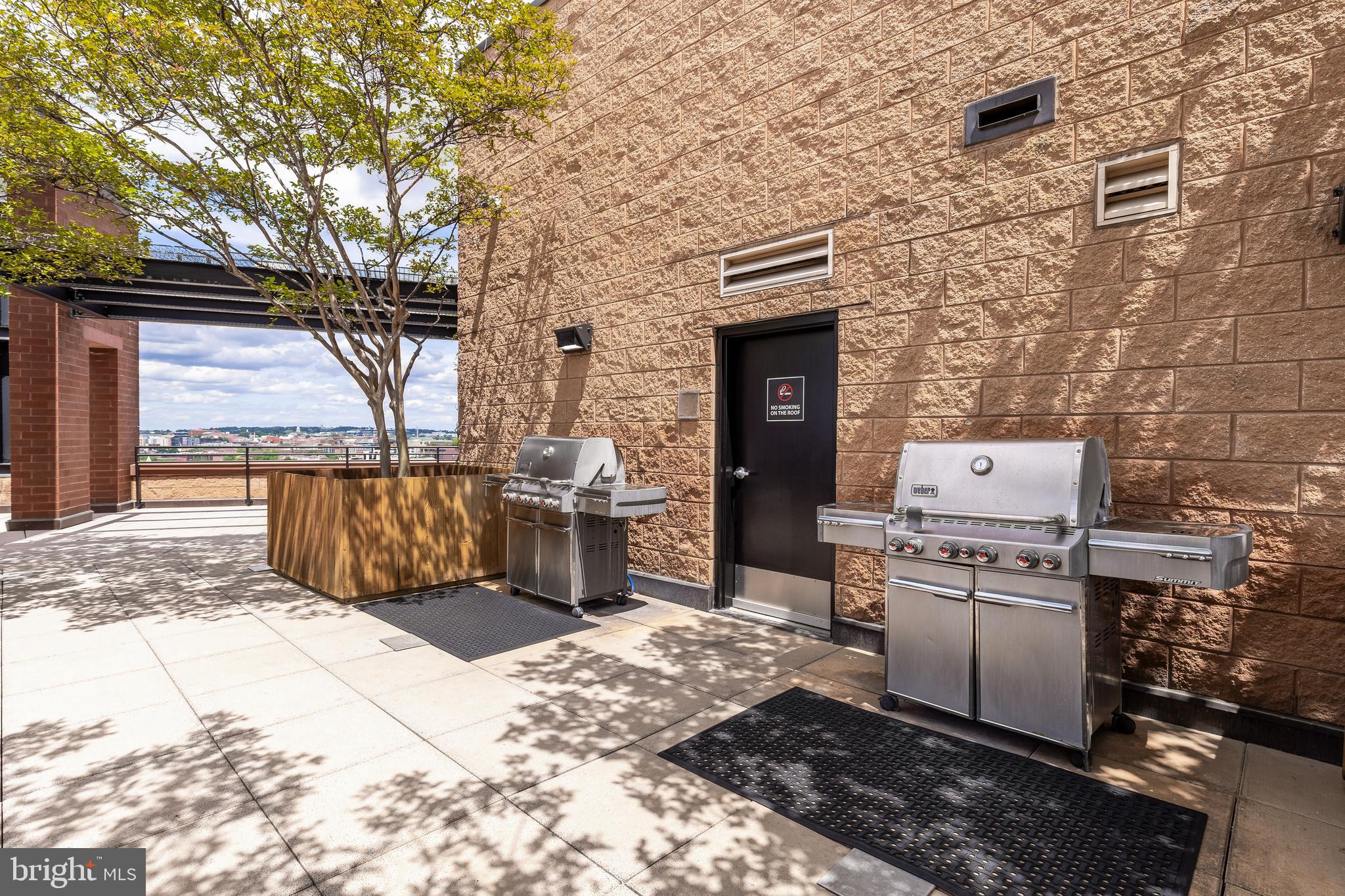 1010 Massachusetts Avenue Northwest, Unit 211 Washington, DC 20001 - Photo 22 of 27 a view of a storage house with wooden fence