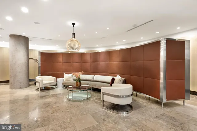 a view of a lobby with furniture and a large window