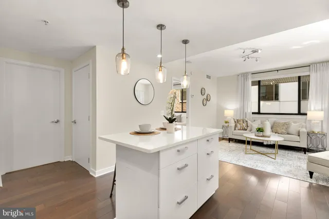a kitchen with a sink cabinets and stainless steel appliances