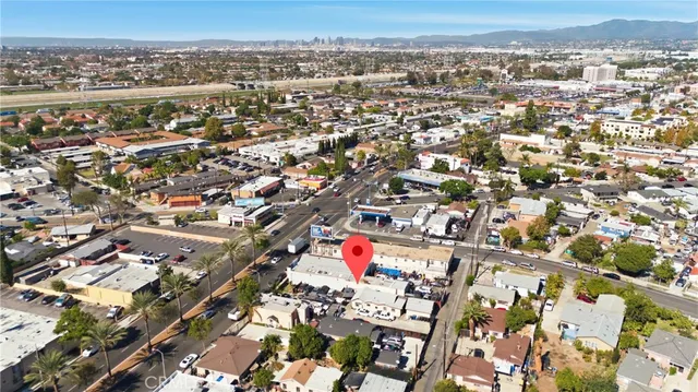 a view of a cars park in front of a building
