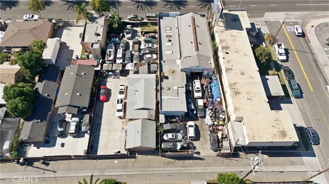 an aerial view of residential houses with street