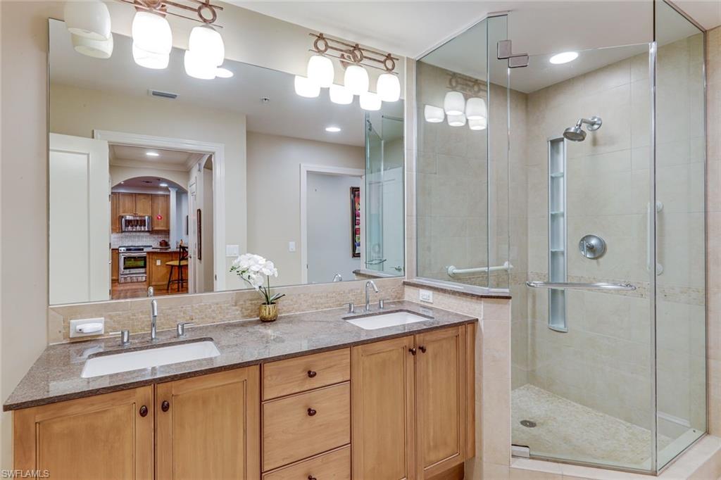 9123 Strada Place, Unit 7201 Naples, FL 34108 - Photo 17 of 50 a bathroom with a granite countertop sink mirror and double