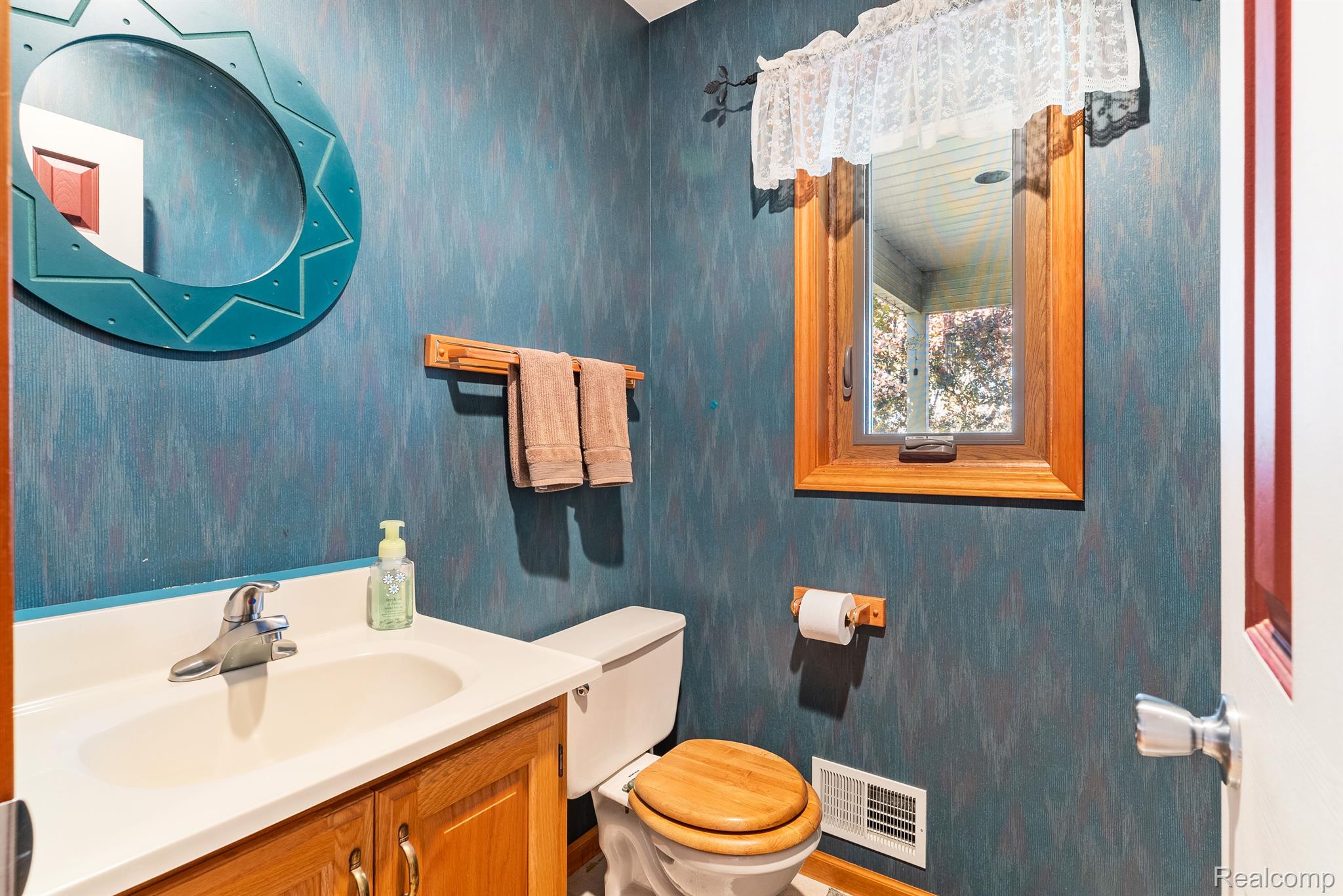6310 Farrand Road Clio, MI 48420 - Photo 14 of 54 Half bathroom just off the kitchen for guests