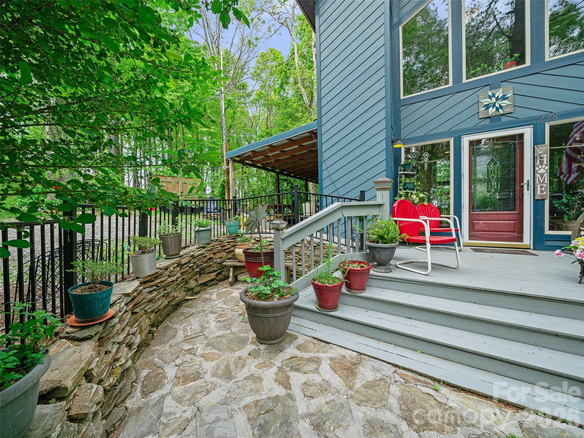 228 Continental Divide Road Spruce Pine, NC 28777 - Photo 48 of 48 a view of a two chairs in the balcony