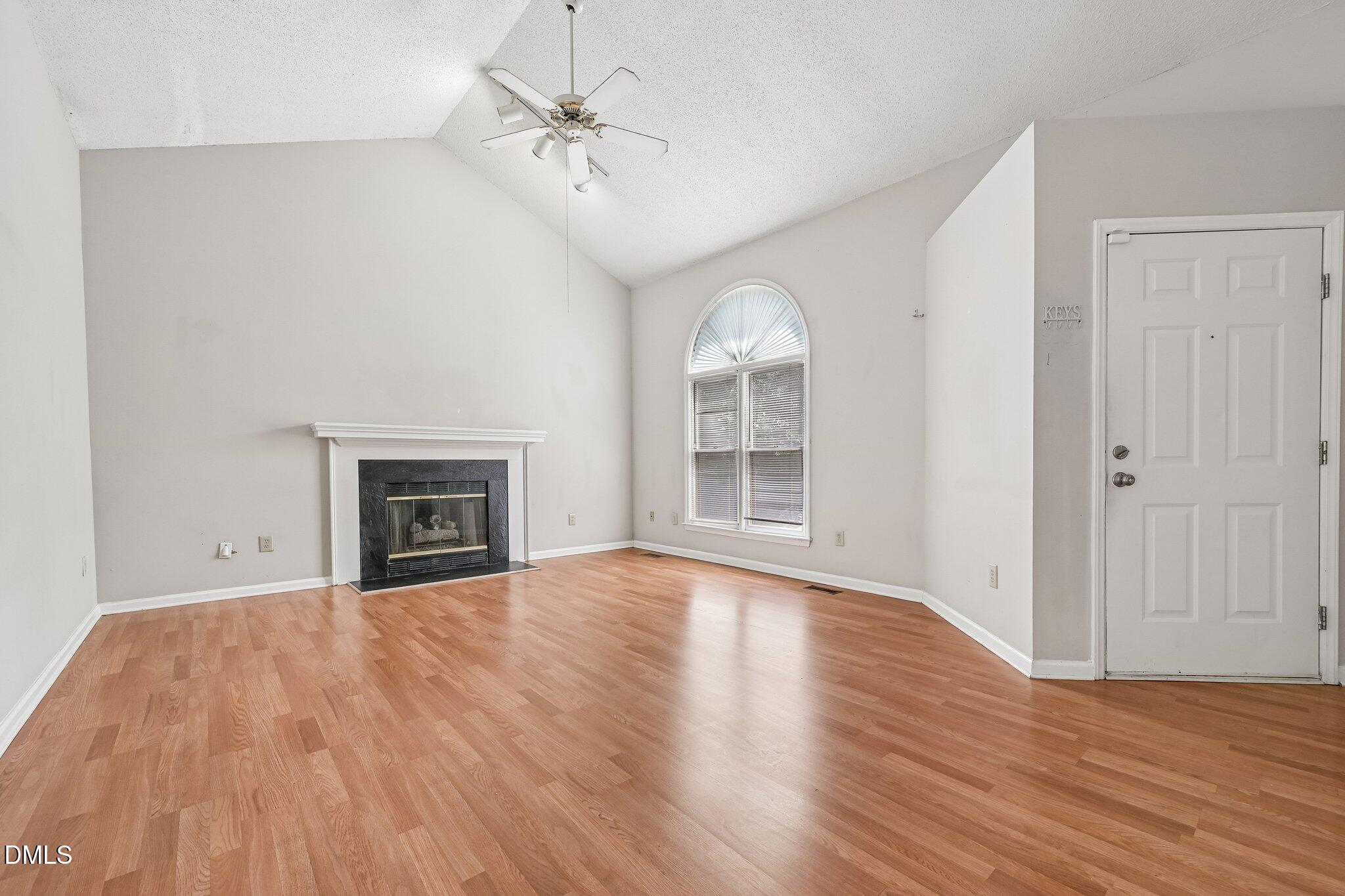 2800 West Jameson Road Raleigh, NC 27604 - Photo 4 of 24 wooden floor fireplace and windows in an empty room