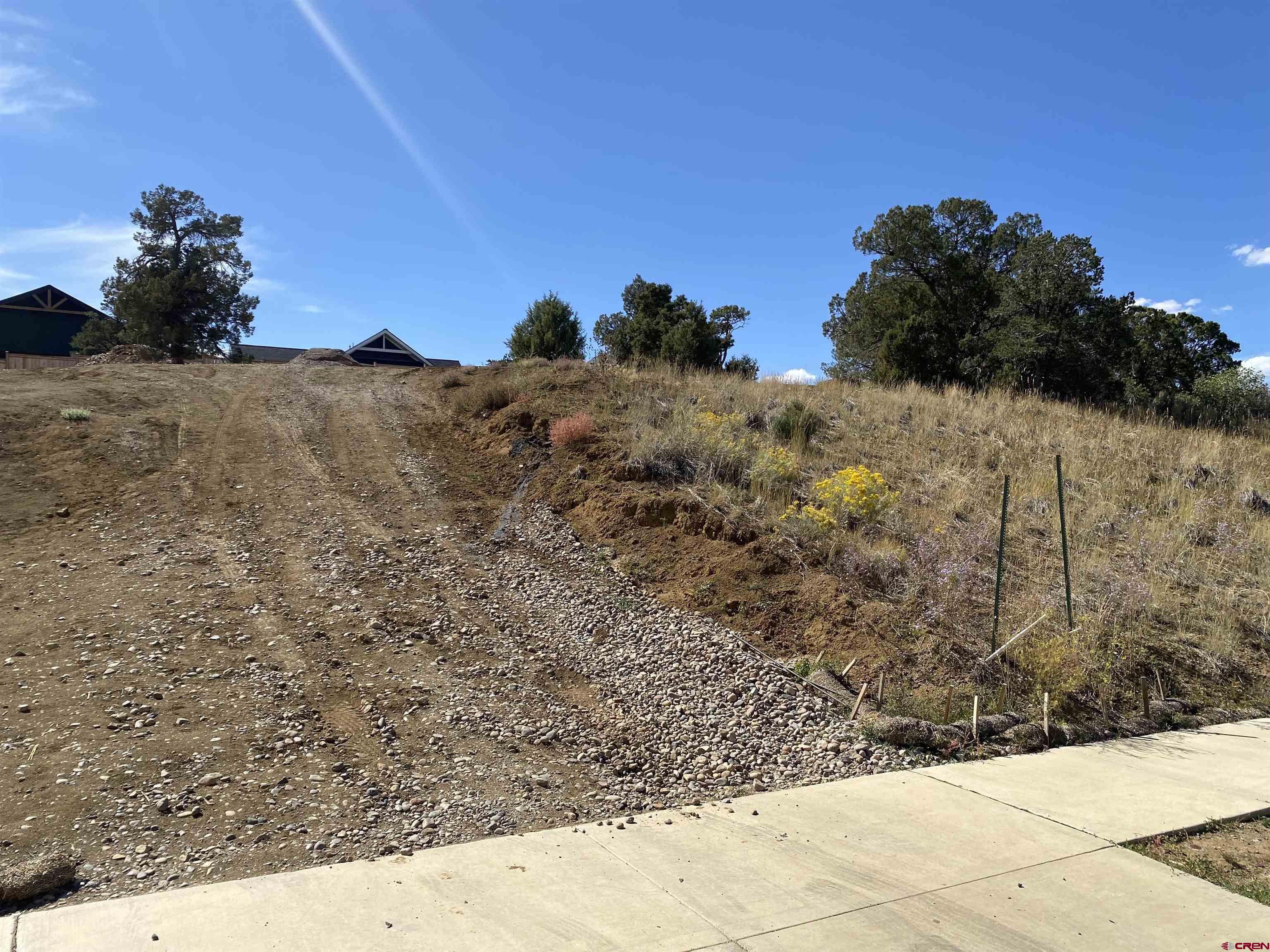 481 Oxbow Circle Durango, CO 81301 - Photo 5 of 16 a view of a dry yard with wooden fence